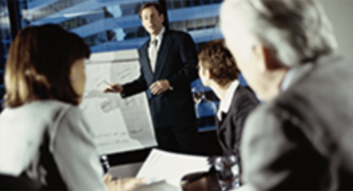 A presenter leading an operations meeting