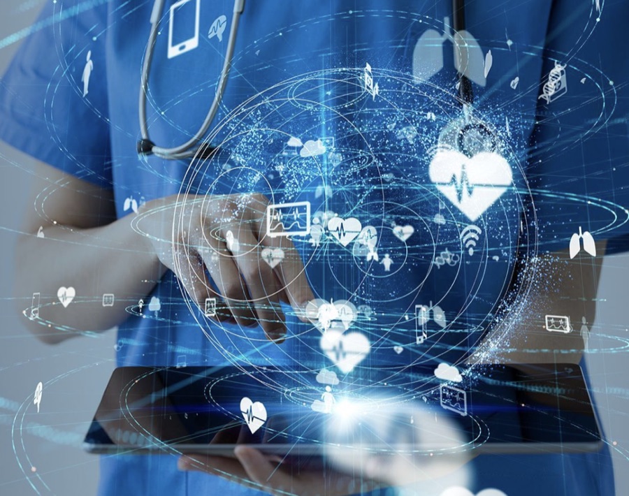 A clinician using a tablet for remote patient data